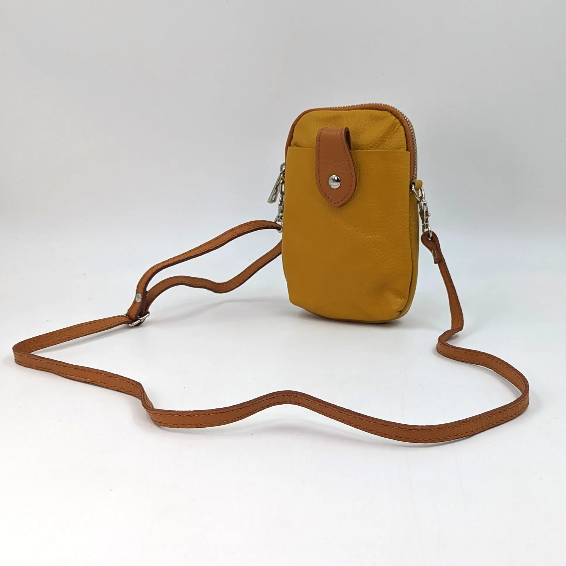 Crossbody mini leather bag with front and back compartments and poppers