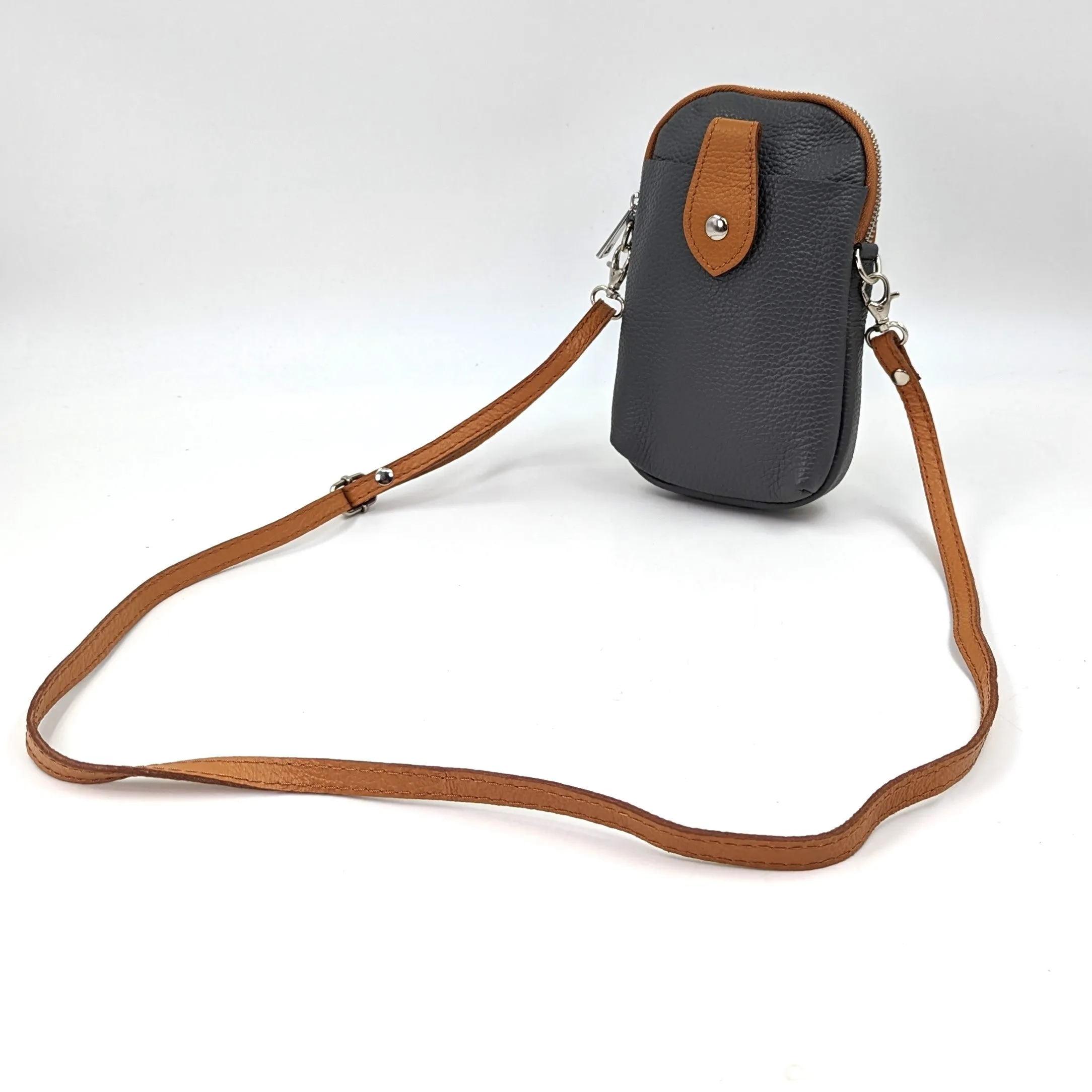 Crossbody mini leather bag with front and back compartments and poppers