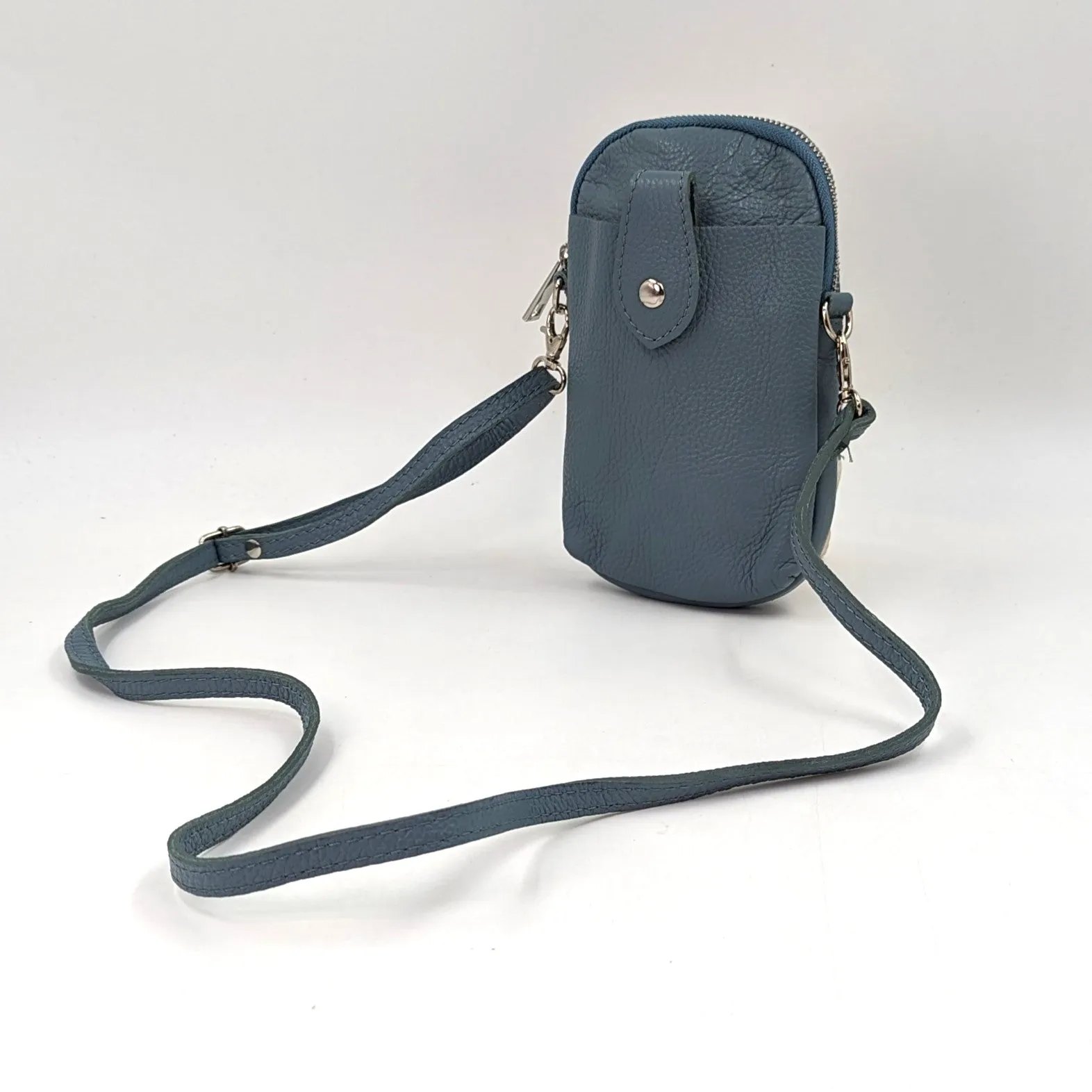 Crossbody mini leather bag with front and back compartments and poppers