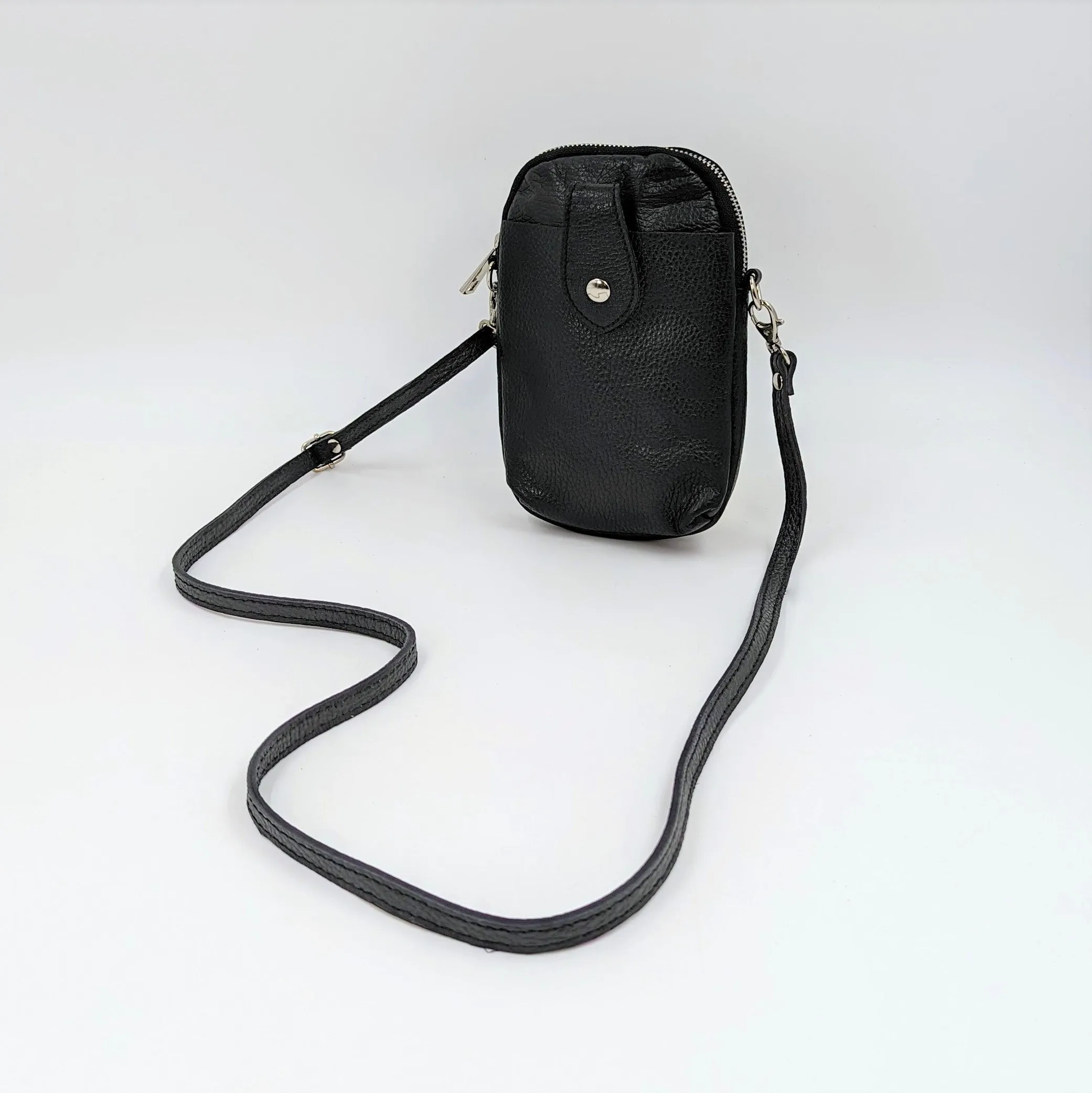 Crossbody mini leather bag with front and back compartments and poppers