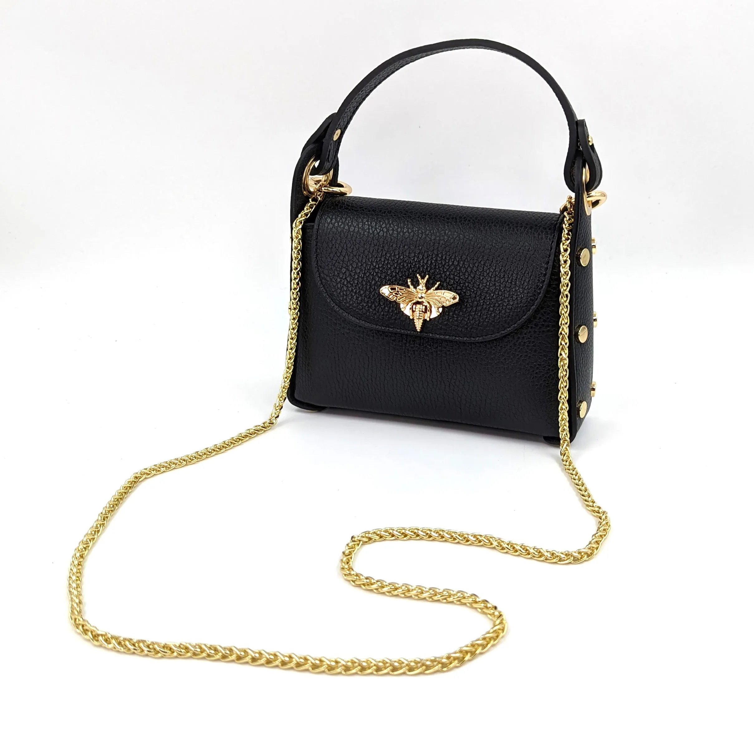 Cute leather handbag with 'Gucci' bee and studded detail on the side and crossbody strap