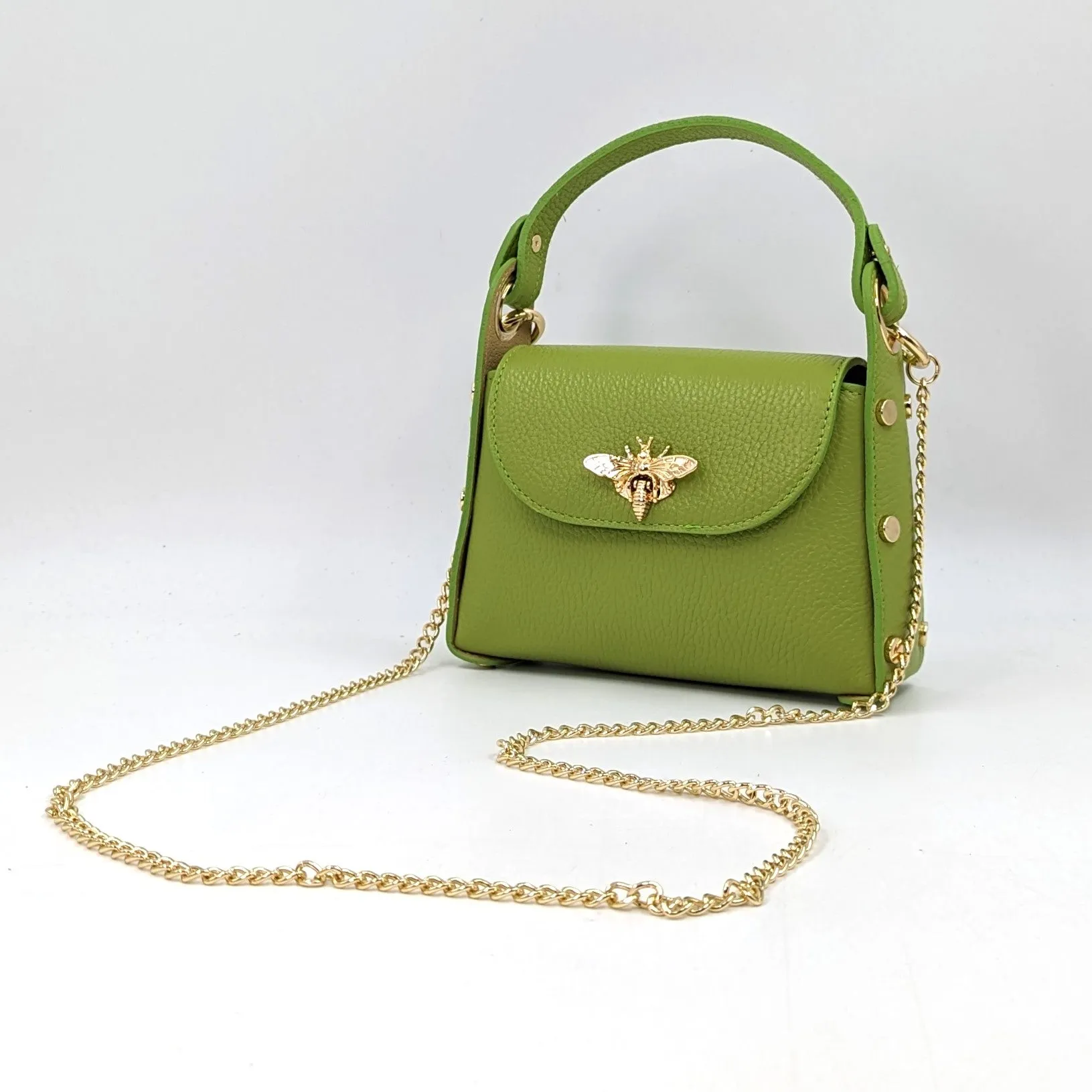 Cute leather handbag with 'Gucci' bee and studded detail on the side and crossbody strap