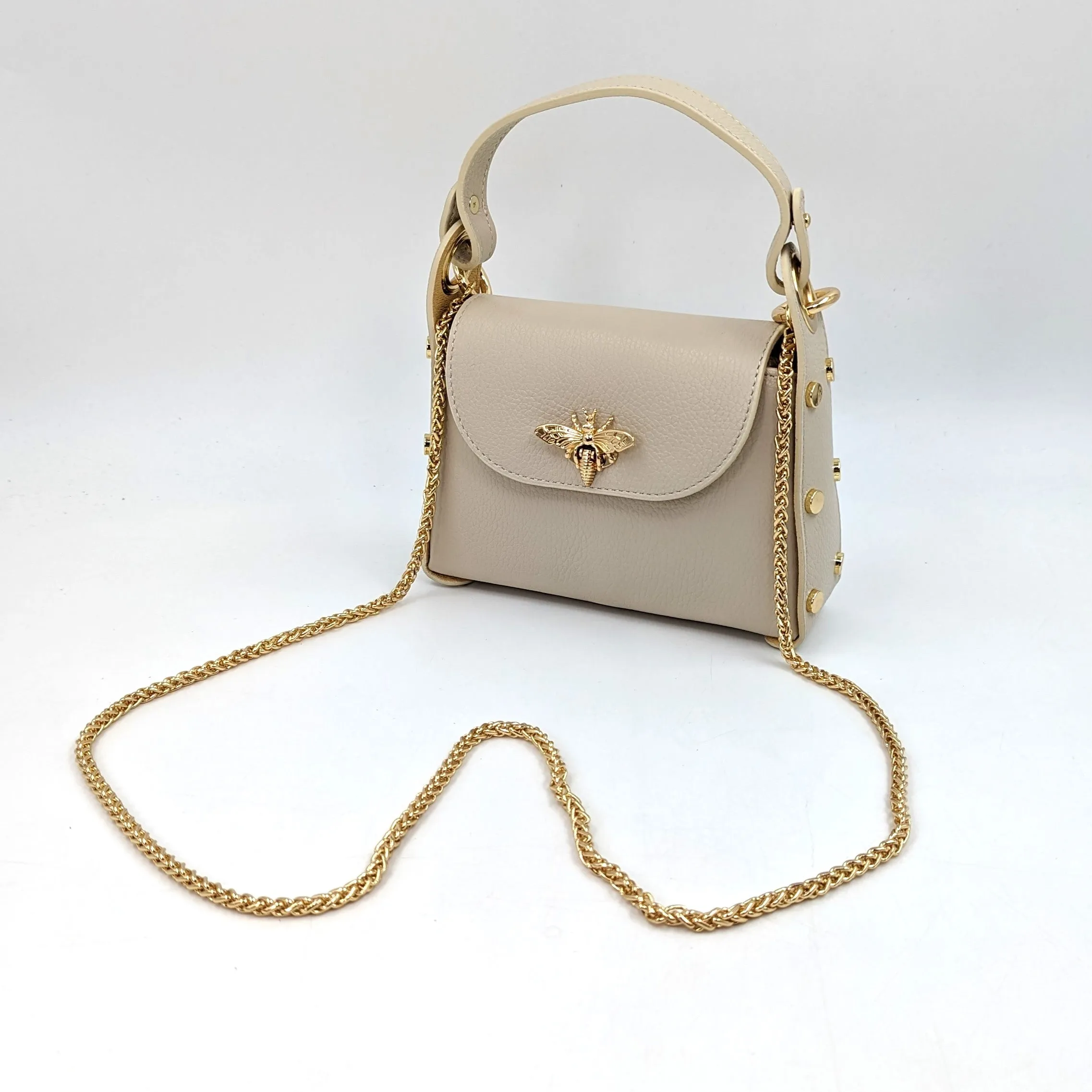 Cute leather handbag with 'Gucci' bee and studded detail on the side and crossbody strap