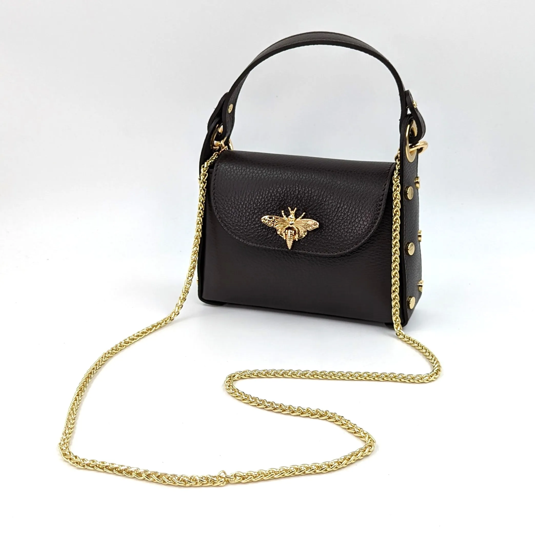 Cute leather handbag with 'Gucci' bee and studded detail on the side and crossbody strap