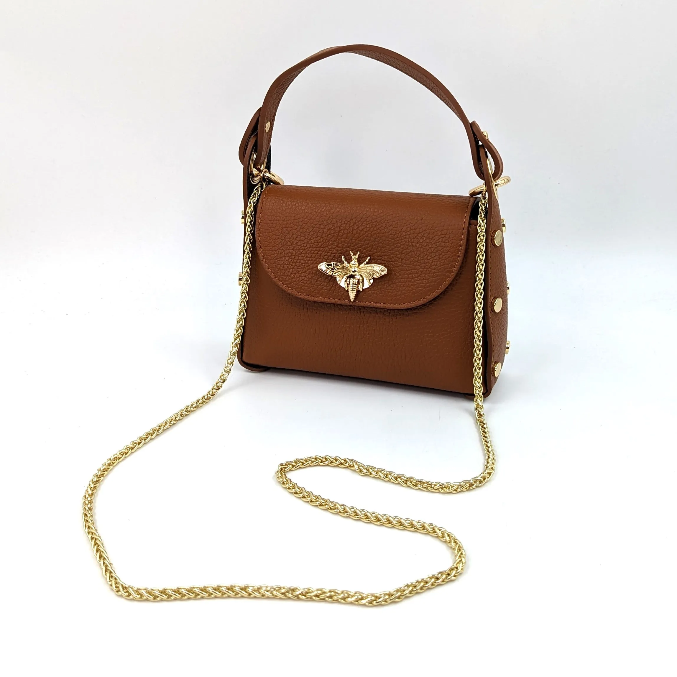 Cute leather handbag with 'Gucci' bee and studded detail on the side and crossbody strap
