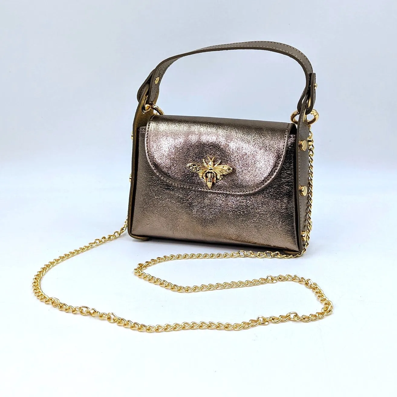 Cute leather handbag with 'Gucci' bee and studded detail on the side and crossbody strap