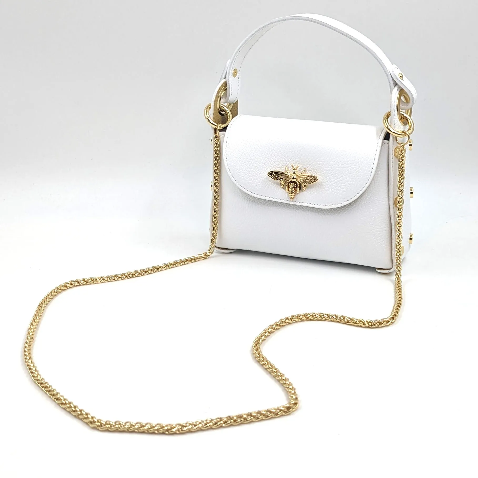Cute leather handbag with 'Gucci' bee and studded detail on the side and crossbody strap