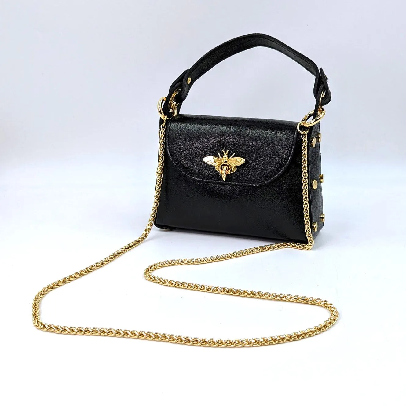 Cute leather handbag with 'Gucci' bee and studded detail on the side and crossbody strap